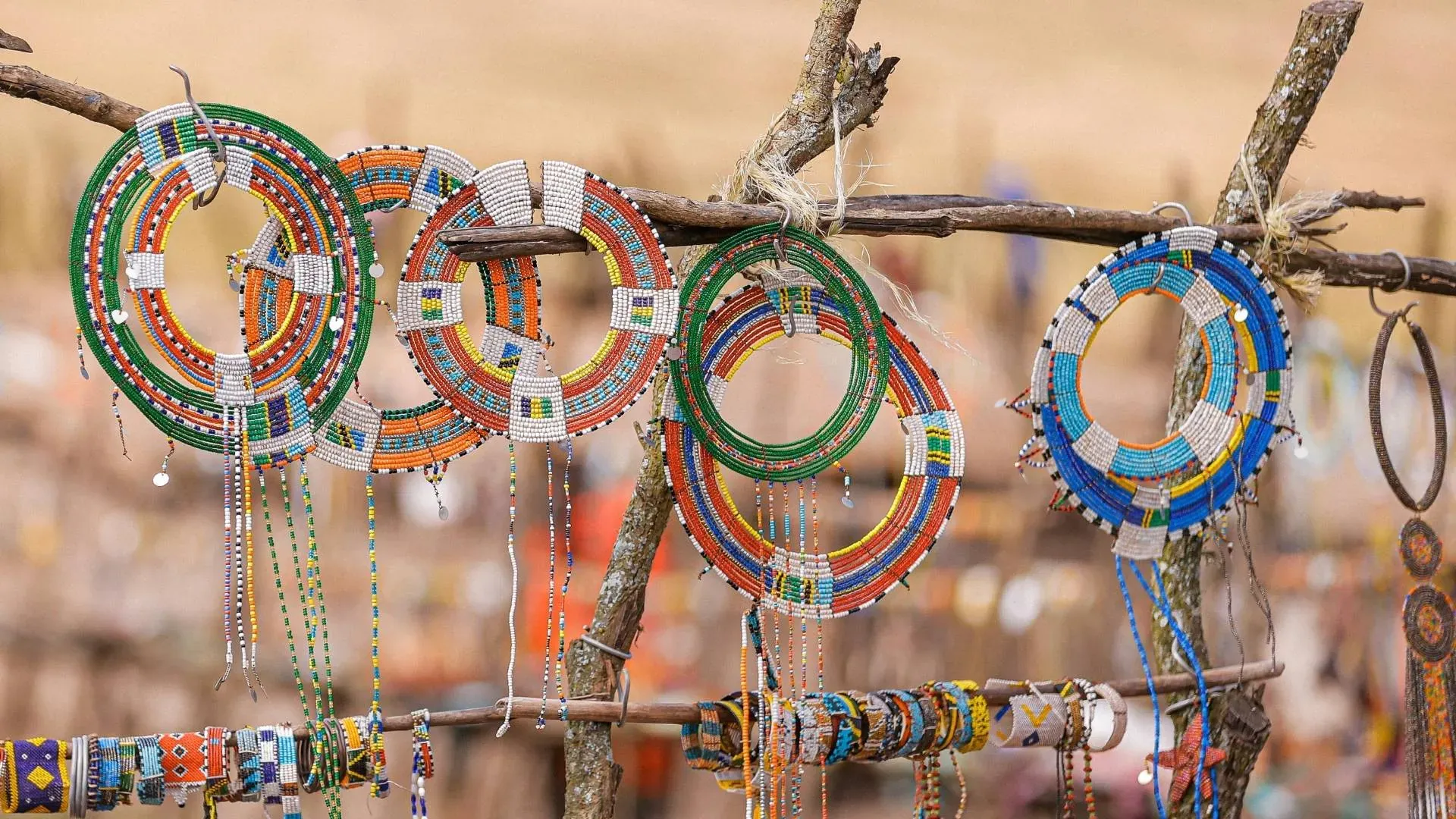 Colourful Maasai beaded necklaces hanging at a market