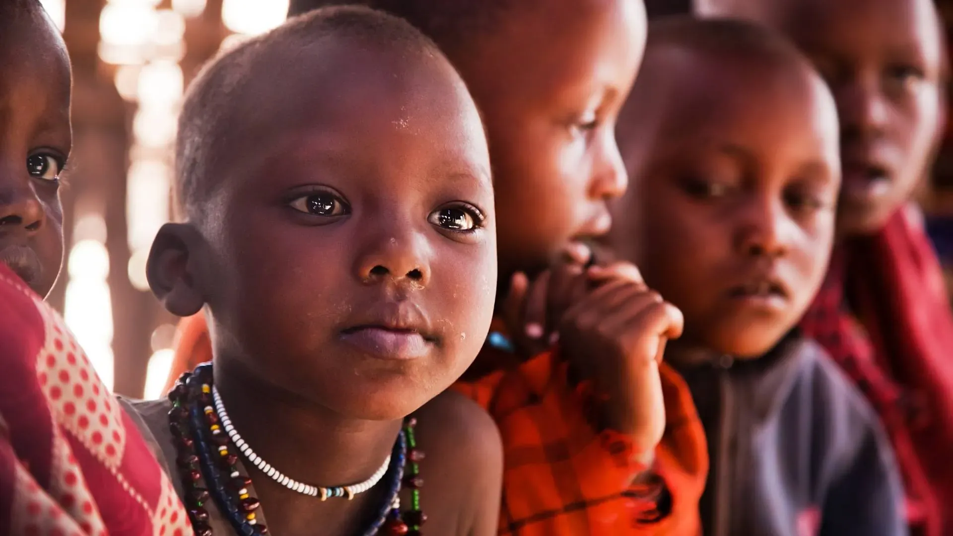 Maasai children in traditional dress and beadwork